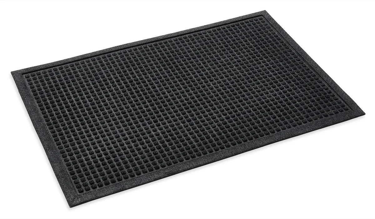 Charcoal water trapper mat with a raised square pattern