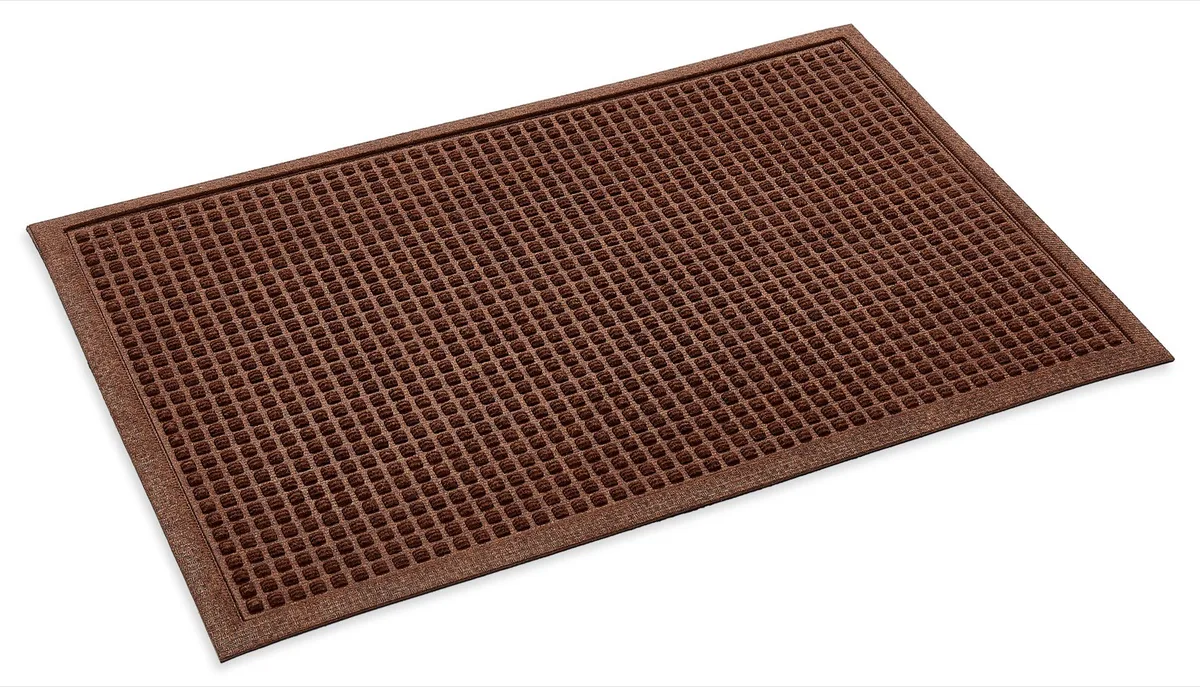 Brown Dirt Trapper doormat with a raised square pattern