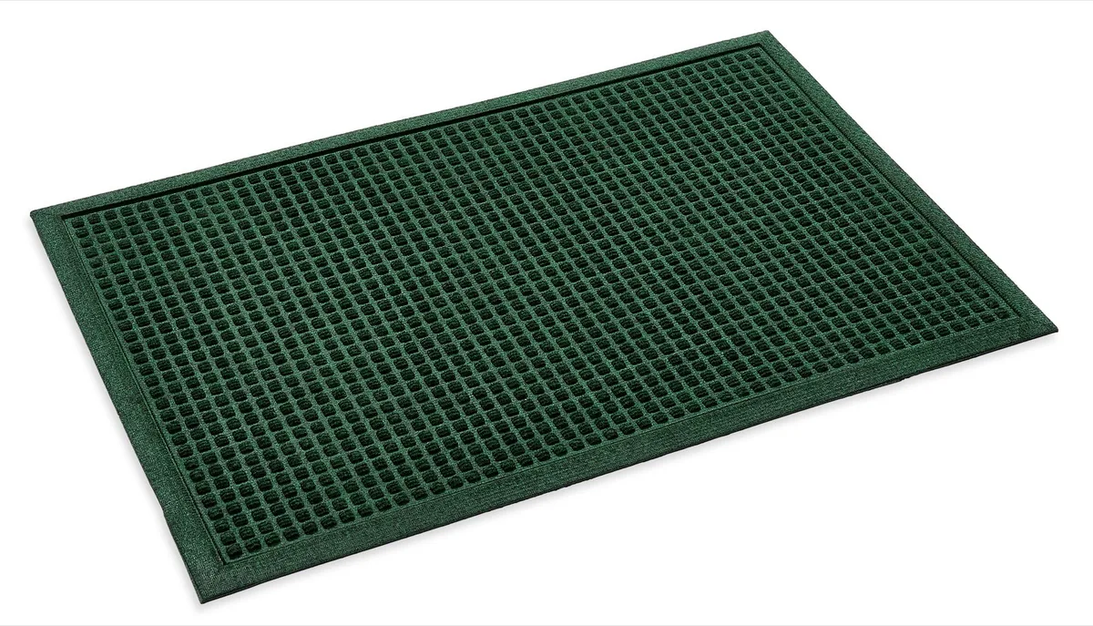 Green Dirt Trapper doormat with a raised square pattern